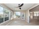 Sunroom with multiple windows and access to the backyard at 1800 Palmetto Isle Dr, Mount Pleasant, SC 29466