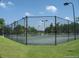 Tennis courts with chain link fence at 1800 Palmetto Isle Dr, Mount Pleasant, SC 29466