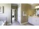 Elegant bathroom with double vanity, soaking tub, and view into bedroom at 211 Bilge Rd, Ridgeville, SC 29472