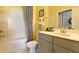 Bright bathroom with a shower-tub combo and a gray vanity with a white countertop and modern fixtures at 211 Bilge Rd, Ridgeville, SC 29472