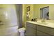 Modern bathroom with gray vanity, chevron shower curtain, and bathtub at 211 Bilge Rd, Ridgeville, SC 29472