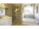 Spa-like bathroom with a soaking tub, walk-in shower, and modern vanity at 211 Bilge Rd, Ridgeville, SC 29472