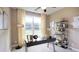 Well-lit home office with a large window, stylish desk, and shelving for organization and decor at 211 Bilge Rd, Ridgeville, SC 29472