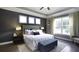 Bright main bedroom with large windows, king bed, and a tranquil atmosphere at 211 Bilge Rd, Ridgeville, SC 29472