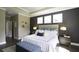 Luxurious main bedroom with a king-size bed and dark accent wall at 211 Bilge Rd, Ridgeville, SC 29472