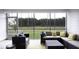 Relaxing screened porch with wooded views and comfortable seating at 211 Bilge Rd, Ridgeville, SC 29472
