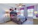 Cozy bedroom with purple walls and floral bedding at 213 Bilge Rd, Ridgeville, SC 29472