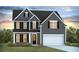 Two-story house with gray siding, white trim, and a two-car garage at 213 Bilge Rd, Ridgeville, SC 29472