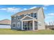 This home features a big yard and screened in porch at rear of home at 213 Bilge Rd, Ridgeville, SC 29472