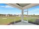 The screened porch features an open view of the big backyard at 213 Bilge Rd, Ridgeville, SC 29472