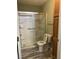 Bathroom includes a shower, toilet, and wooden cabinet for toiletries at 214 Hardee Ave Ave, Summerville, SC 29485