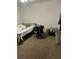 Simple bedroom with carpeted floor, a bed, and a small desk at 214 Hardee Ave Ave, Summerville, SC 29485