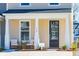 Dark gray front door with glass panes, flanked by white columns at 233 Abercom Place Dr, Moncks Corner, SC 29461