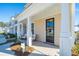 Townhome front porch with seating and landscaping at 233 Abercom Place Dr, Moncks Corner, SC 29461