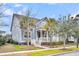 Two-story house with gray siding, white trim, and palm trees at 2433 Louisville St, Charleston, SC 29492