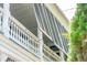 White columns and gray shutters on a charming balcony at 27 Chapel St, Charleston, SC 29403
