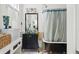 Bathroom with clawfoot tub, shower, and black vanity at 27 Chapel St, Charleston, SC 29403