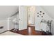 Simple attic bedroom with hardwood floors and access to a bathroom at 27 Chapel St, Charleston, SC 29403