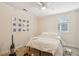 Bedroom with a double bed, wall-mounted photo display, and carpeted floor at 27 Chapel St, Charleston, SC 29403