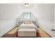 Cozy attic bedroom with a full-size bed and hardwood floors at 27 Chapel St, Charleston, SC 29403