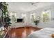 Light-filled bedroom with hardwood floors and white dresser at 27 Chapel St, Charleston, SC 29403