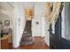 Grand curved staircase in the entryway of this home at 27 Chapel St, Charleston, SC 29403