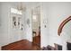 Bright entryway with hardwood floors, chandelier, and access to staircase at 27 Chapel St, Charleston, SC 29403