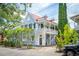 Charming two-story home with a metal roof and a wrap-around porch at 27 Chapel St, Charleston, SC 29403