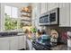 Kitchen detail showing granite countertops and stainless steel appliances at 27 Chapel St, Charleston, SC 29403