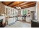 Kitchen with white cabinets, wood ceiling beams, and stainless steel appliances at 27 Chapel St, Charleston, SC 29403