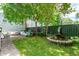 Stone patio with comfortable seating area, surrounded by greenery at 27 Chapel St, Charleston, SC 29403