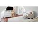 Relaxing attic sitting area features comfortable seating and a large TV at 27 Chapel St, Charleston, SC 29403