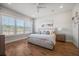 Spacious bedroom with wood floors and large windows, showcasing a king-size bed at 274 Tupelo Lake Dr, Summerville, SC 29486