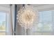 Elegant crystal chandelier illuminates a bright dining space at 274 Tupelo Lake Dr, Summerville, SC 29486