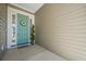 Inviting teal front door with wreath and sidelights at 274 Tupelo Lake Dr, Summerville, SC 29486