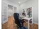 Home office with built-in shelving, an electric standing desk, and French doors at 274 Tupelo Lake Dr, Summerville, SC 29486