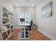 Home office with built-in shelving and an electric standing desk at 274 Tupelo Lake Dr, Summerville, SC 29486