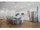 Elegant kitchen boasting white cabinetry, stainless steel appliances, and an expansive island at 274 Tupelo Lake Dr, Summerville, SC 29486