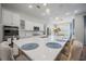 Modern kitchen with white cabinets, stainless steel appliances, and a large island at 274 Tupelo Lake Dr, Summerville, SC 29486