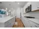 Modern kitchen with white shaker cabinets, stainless steel appliances and quartz countertops at 274 Tupelo Lake Dr, Summerville, SC 29486