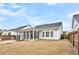 Spacious backyard with screened porch and grassy area at 327 Great Lawn Dr, Summerville, SC 29486
