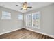 Bright bedroom with hardwood floors, plantation shutters and ceiling fan at 327 Great Lawn Dr, Summerville, SC 29486