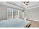 Main bedroom with hardwood floors and window shutters at 327 Great Lawn Dr, Summerville, SC 29486