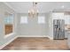 Bright dining room with chandelier and hardwood floors at 327 Great Lawn Dr, Summerville, SC 29486