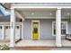 Inviting front porch with yellow door and porch swing at 327 Great Lawn Dr, Summerville, SC 29486