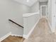 Upstairs hallway with wood stairs and carpet flooring at 327 Great Lawn Dr, Summerville, SC 29486