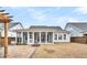 House back view, showcasing a screened porch and yard at 327 Great Lawn Dr, Summerville, SC 29486