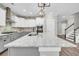 Kitchen boasts granite countertops and gray cabinets at 327 Great Lawn Dr, Summerville, SC 29486