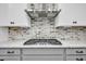 Gas cooktop with stainless steel range hood at 327 Great Lawn Dr, Summerville, SC 29486
