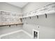 Laundry room with shelving, wood accent wall, and pet door at 327 Great Lawn Dr, Summerville, SC 29486